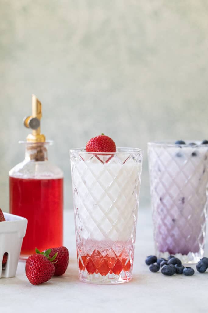 Italian soda recipe with strawberry syrup and blueberry syrup.