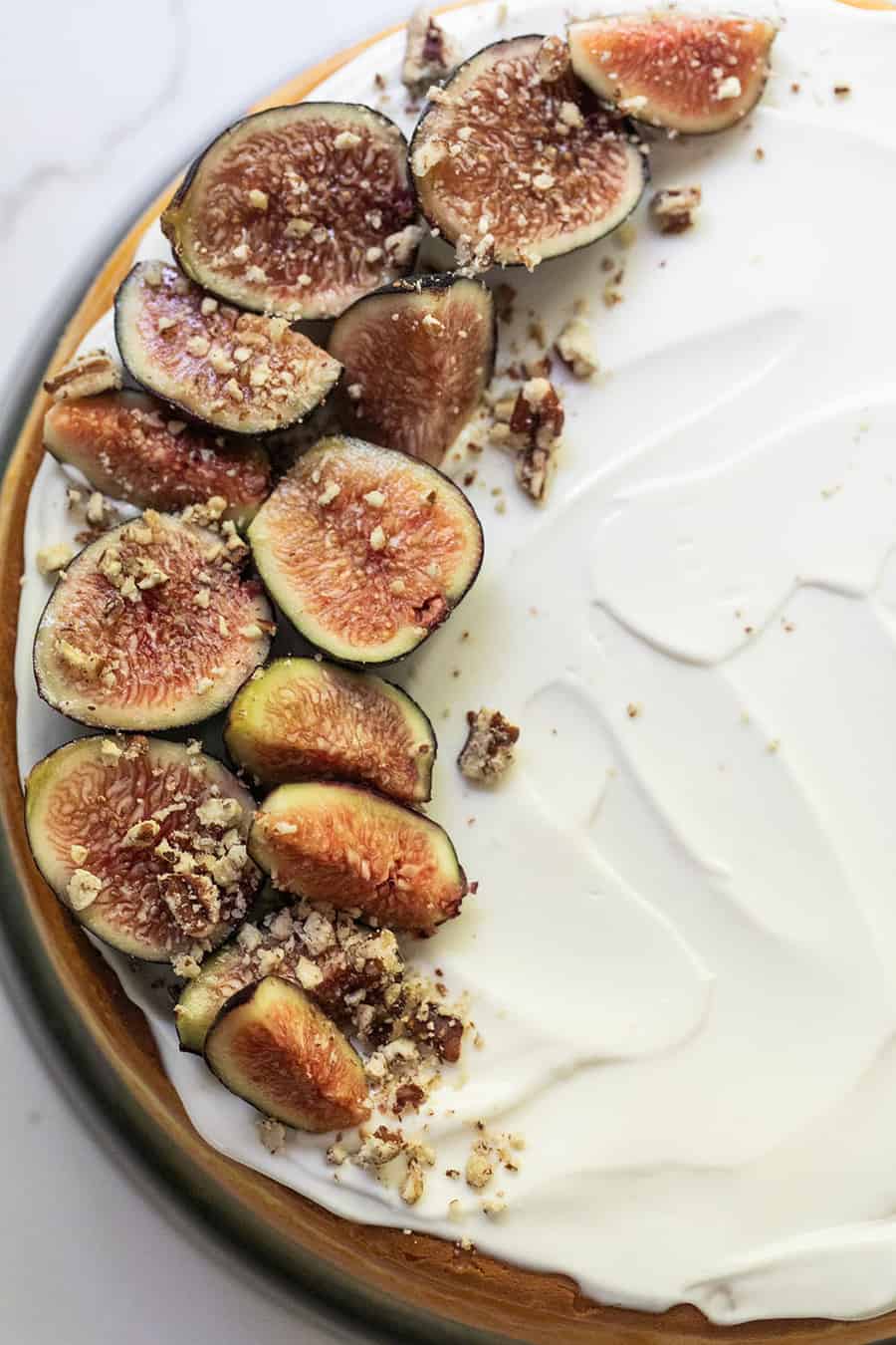 Goat cheese cheesecake recipe with figs and a sour cream frosting. 