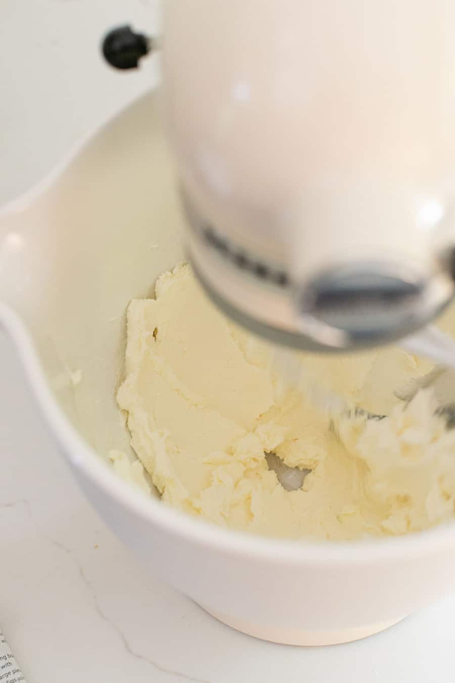 Mixing cream cheese in a mixer