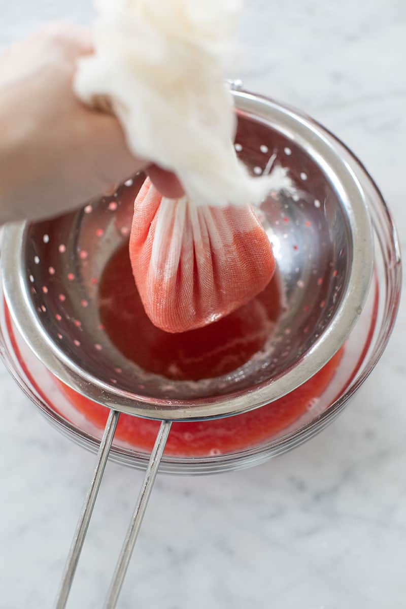 Straining watermelon juice. 