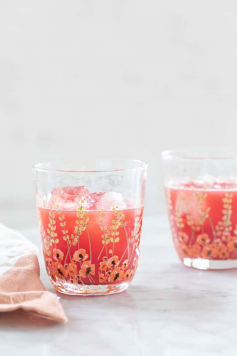 Watermelon juice in a glass with painted flowers. 