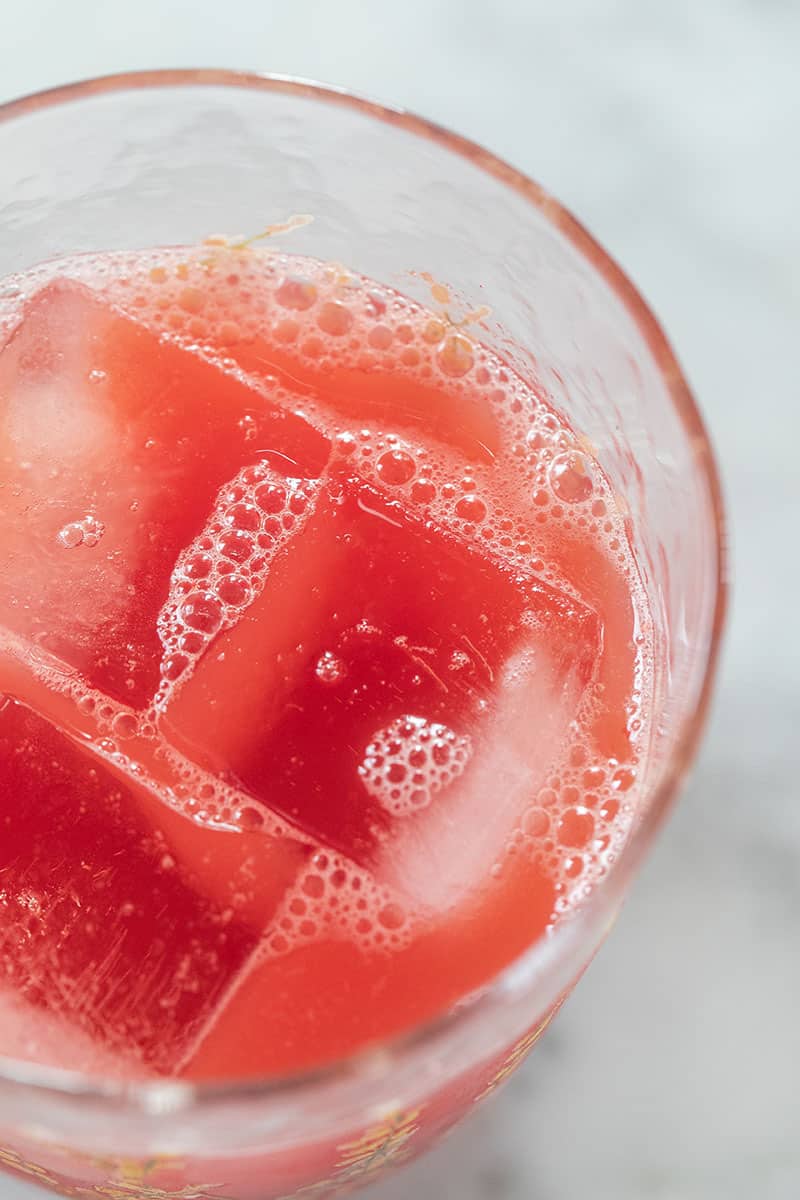 fresh juice in a glass with ice 