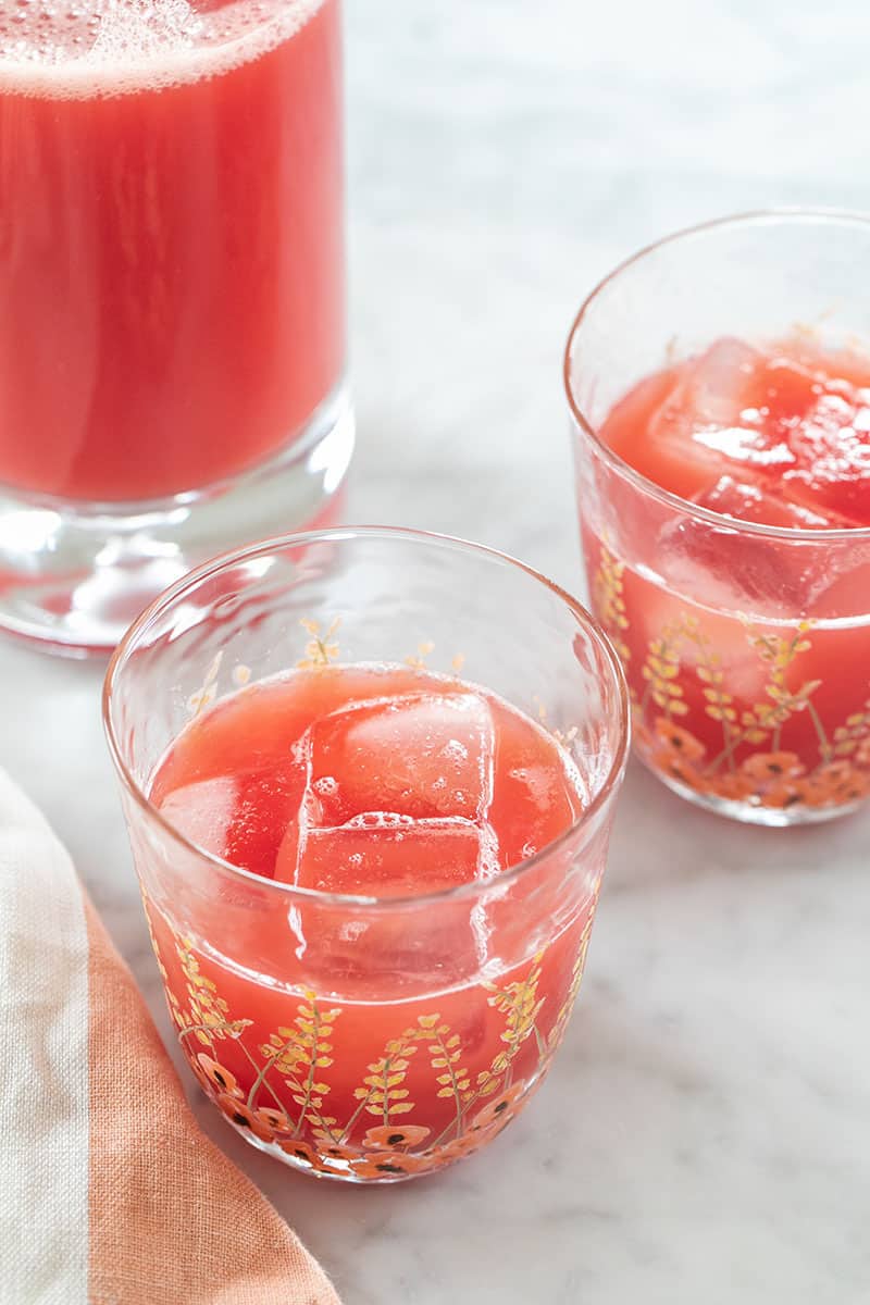 Glass of watermelon juice on a marble table. 