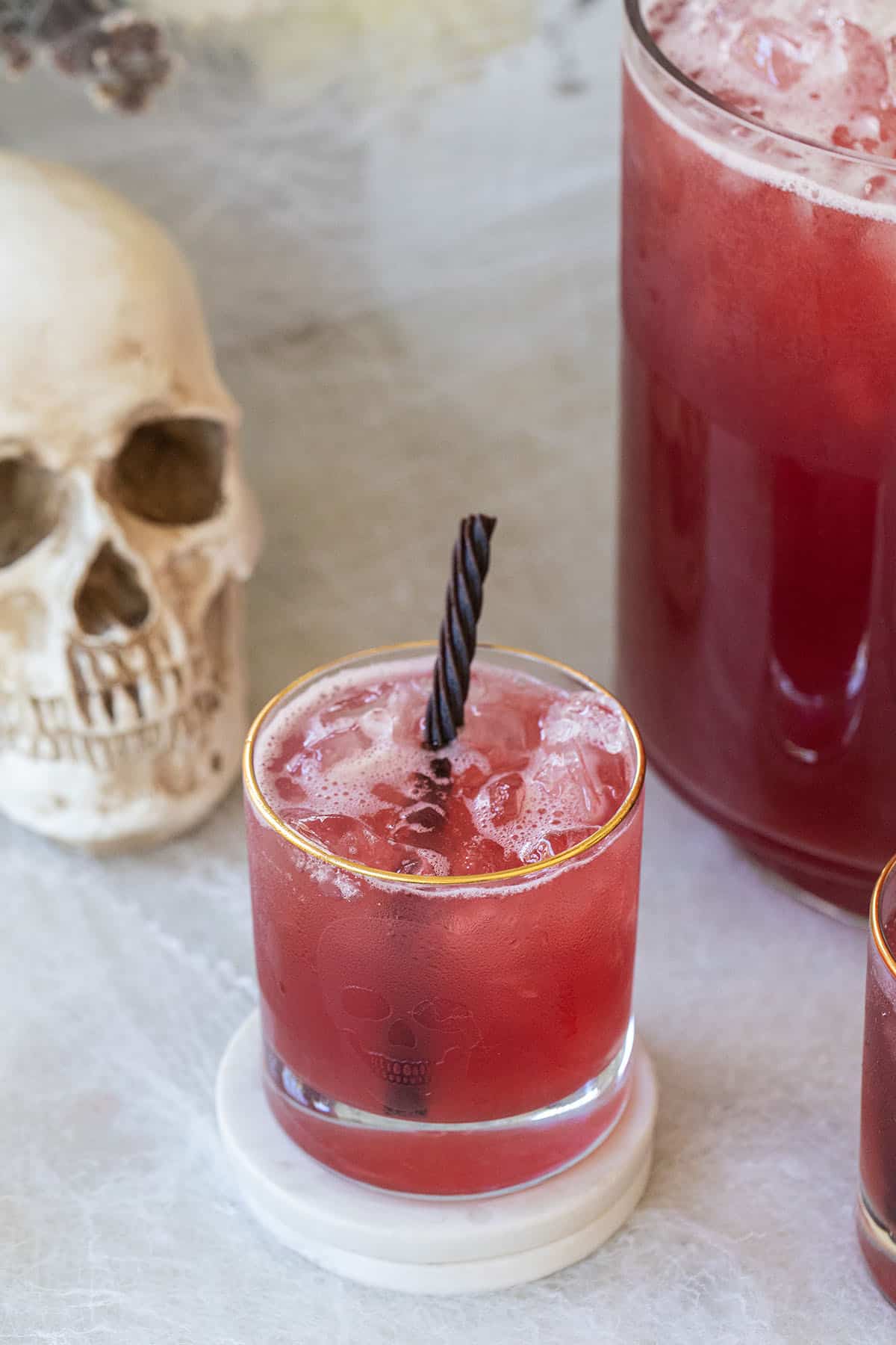 Jolly Rancher punch with a fun candy straw and a skull glass.