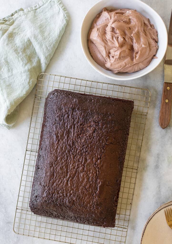 Moist chocolate cake on a cooling rack before frosting.