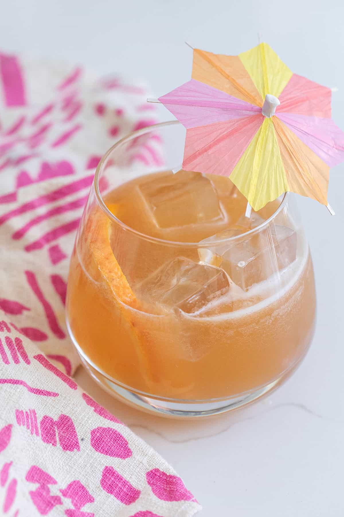 Easy rum punch in a glass with a little umbrella. 