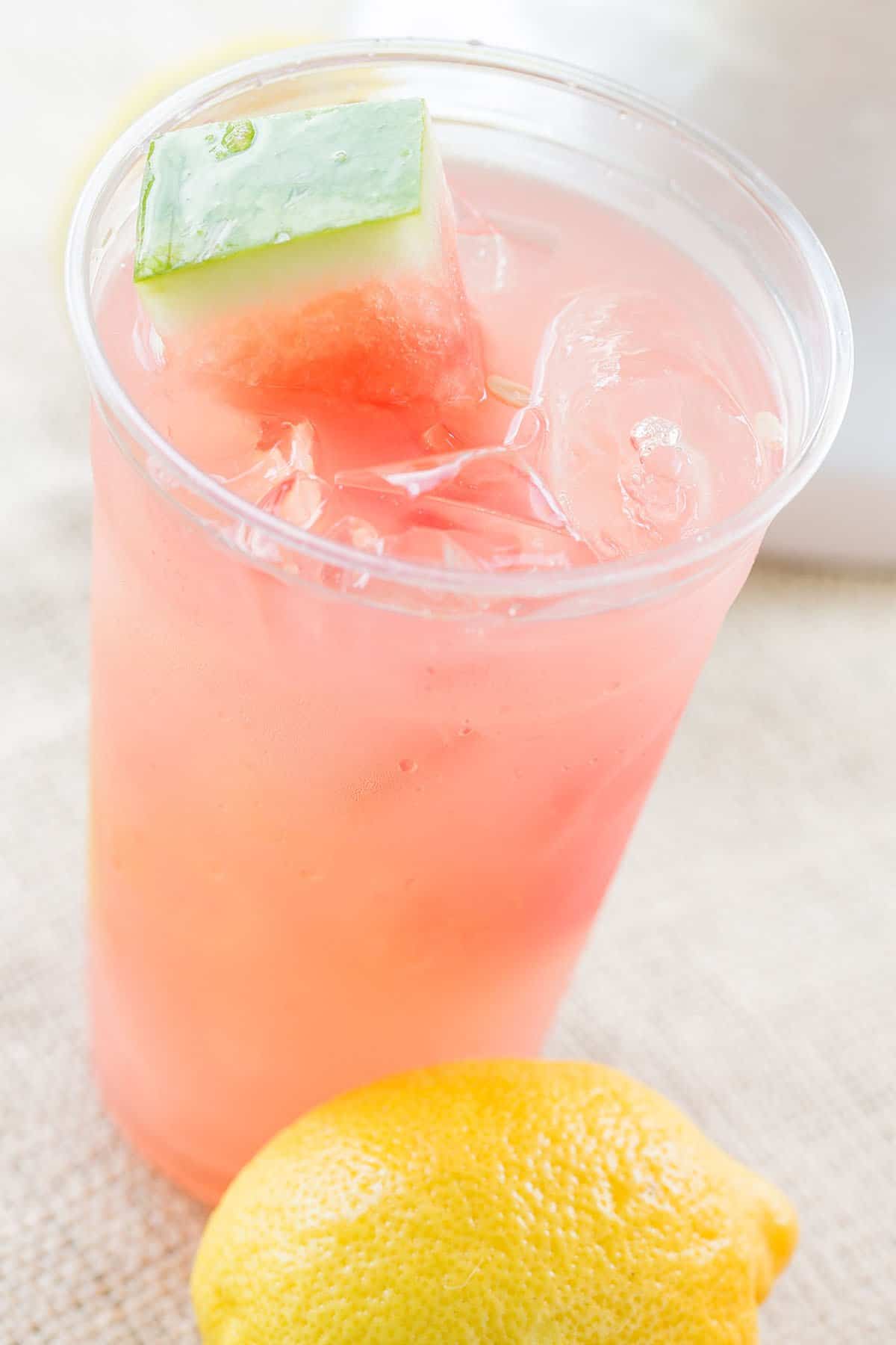 pink summer drink in a glass - watermelon lemonade, lemon juice, fresh mint, lemon slices, seedless watermelon, granulated sugar, sweet tart