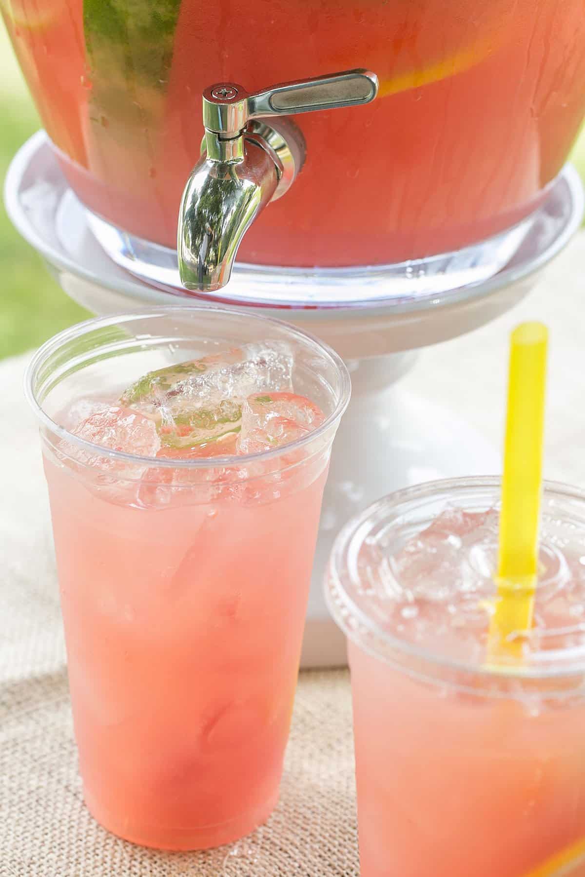 pink summer drink in a cup - watermelon lemonade, lemon juice, fresh mint, fresh watermelon lemonade, fresh watermelon juice, fresh watermelon lemonade, granulated sugar, most refreshing summer drink, fresh watermelon, ice cubes