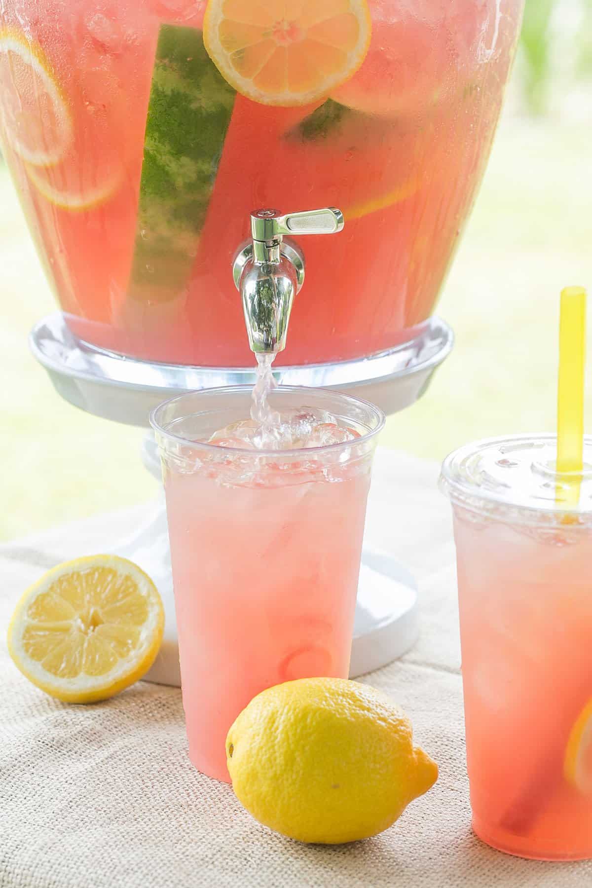 watermelon lemonade in a large glass container - watermelon lemonade, refreshing summer drink, fresh mint, fresh watermelon lemonade, fresh watermelon