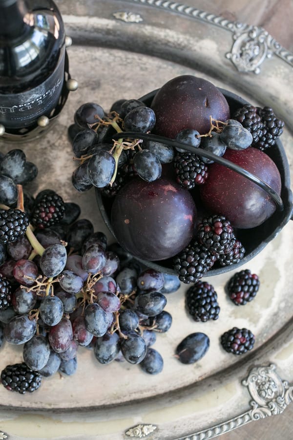 Black fruit on a platter.