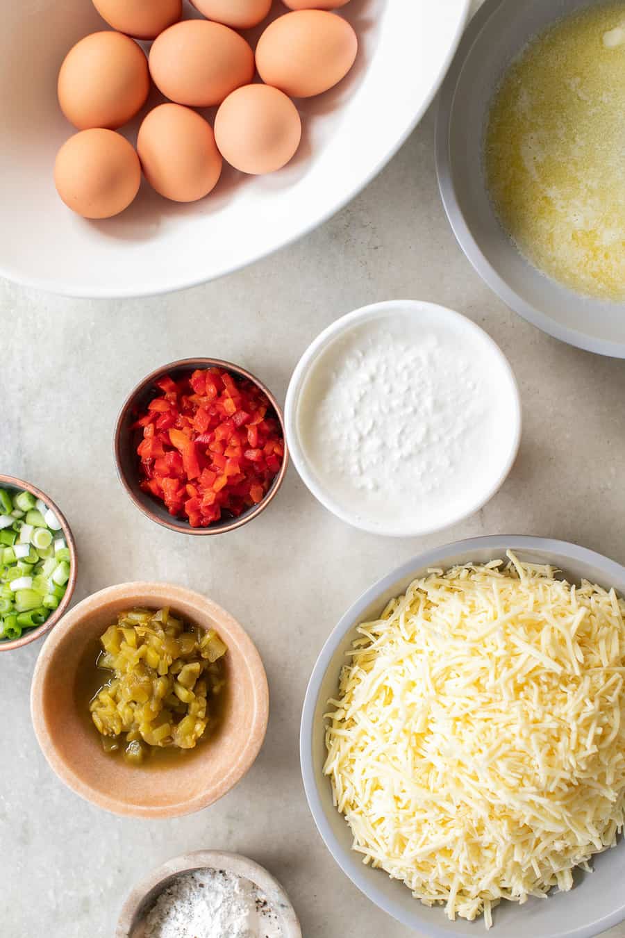 Eggs, cottage cheese, butter, green chilis, pimentos, onions and cheese to make a frittata