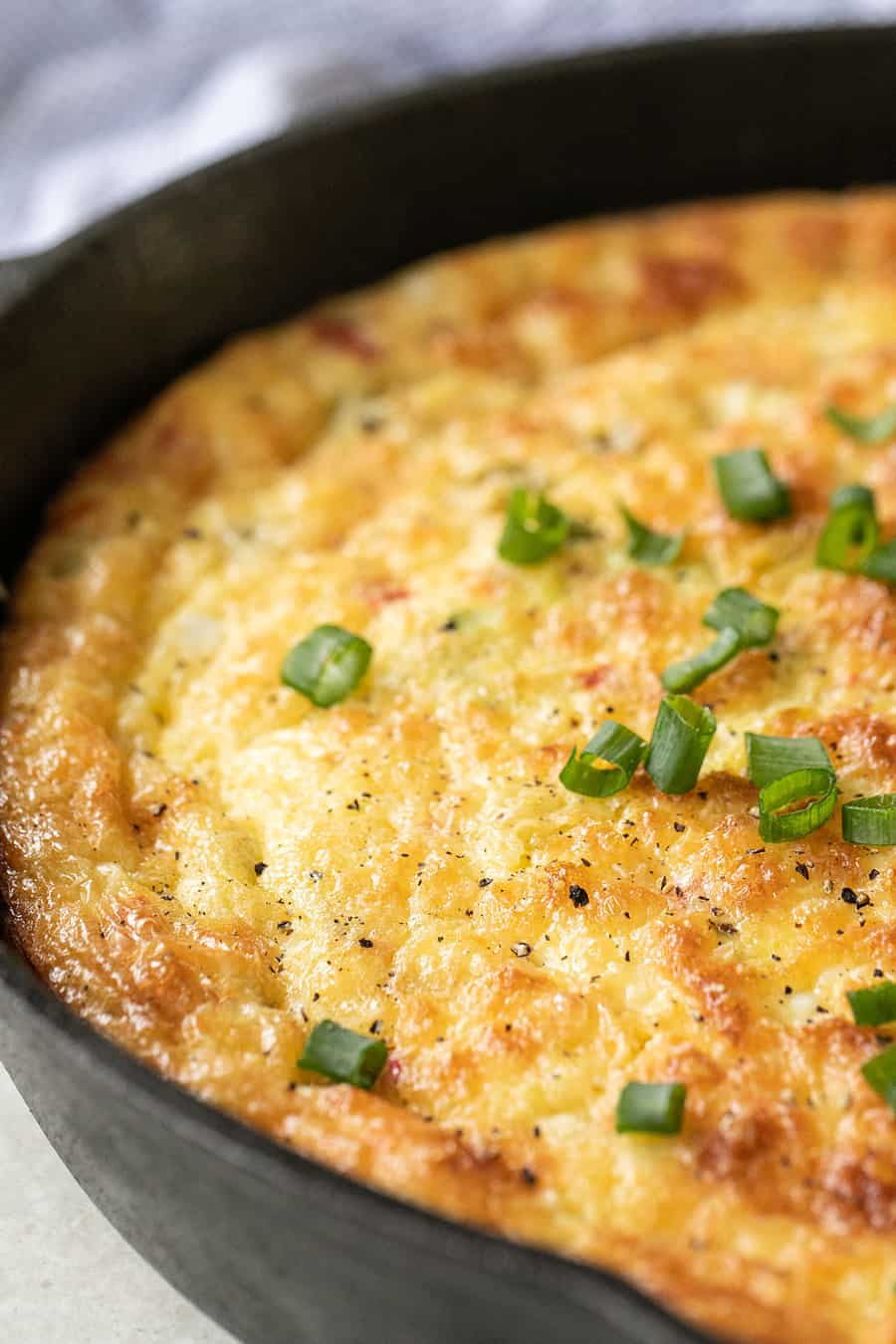 The best easy frittata recipe with green onions in a cast iron skillet 