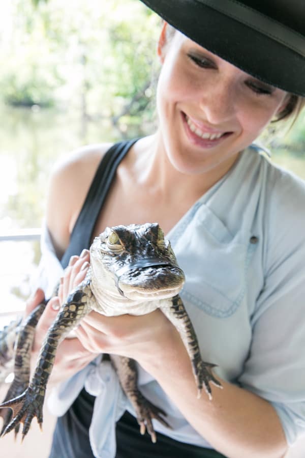 Eden Passante holding a baby alligator 
