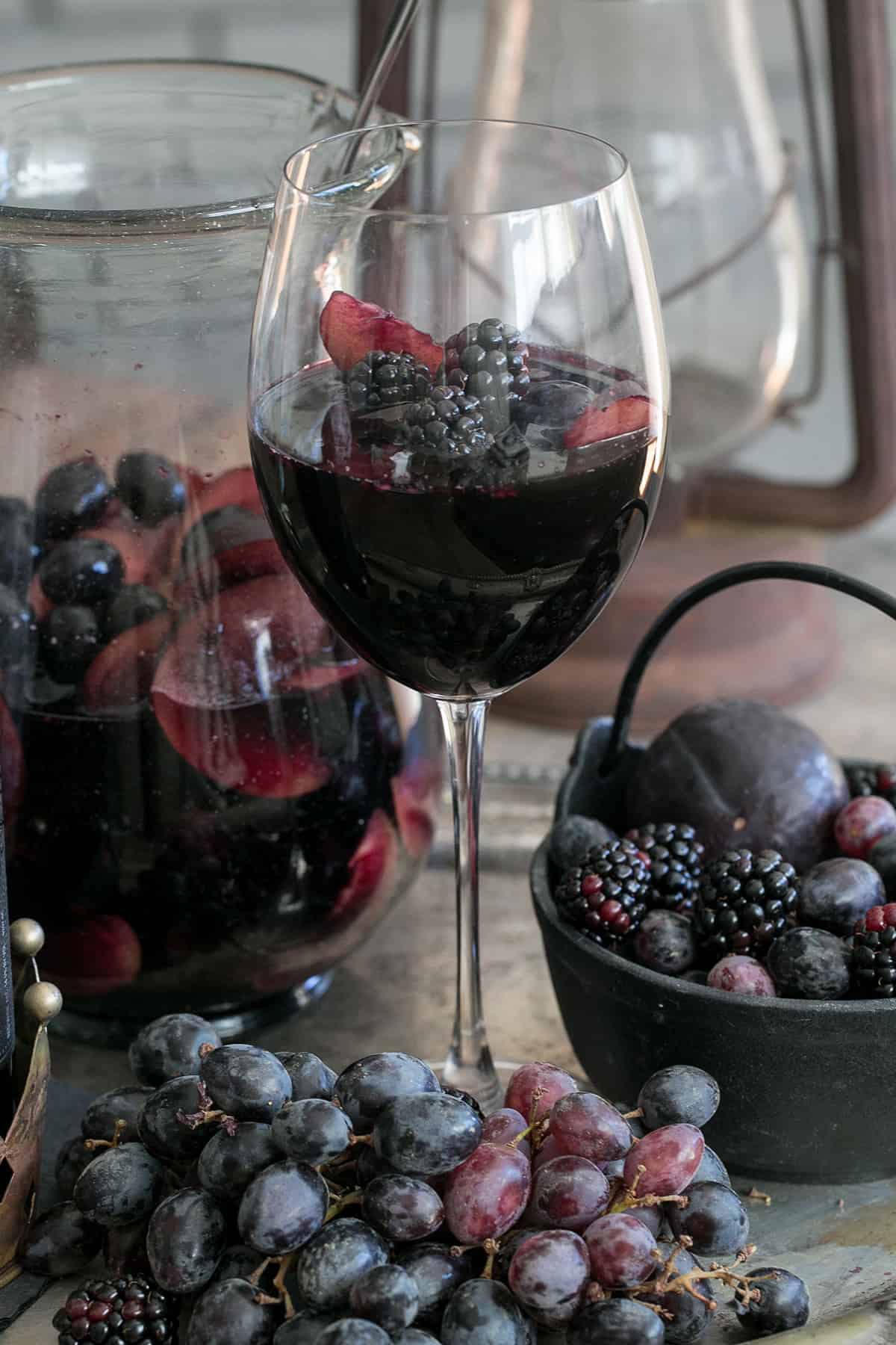 Black sangria in a wine glass for Halloween.