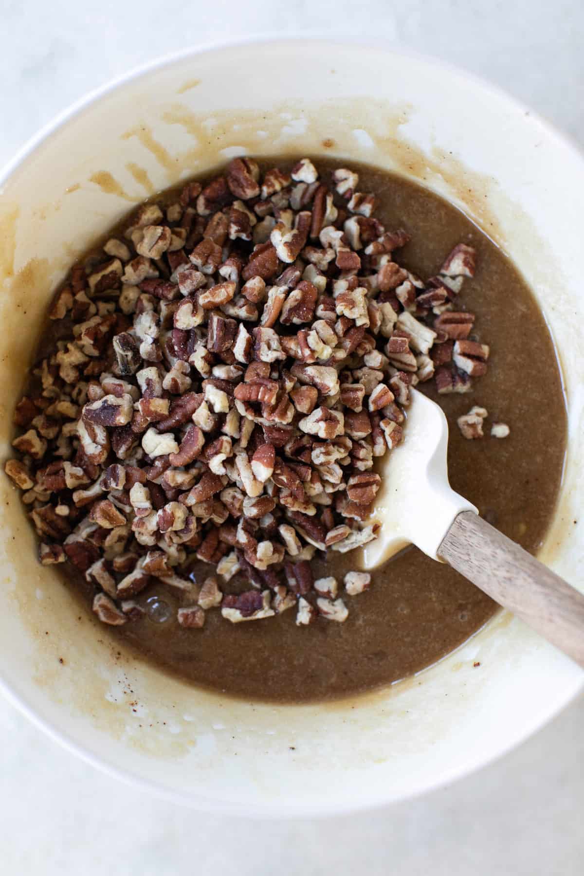 chopped pecans in a pecan pie filling