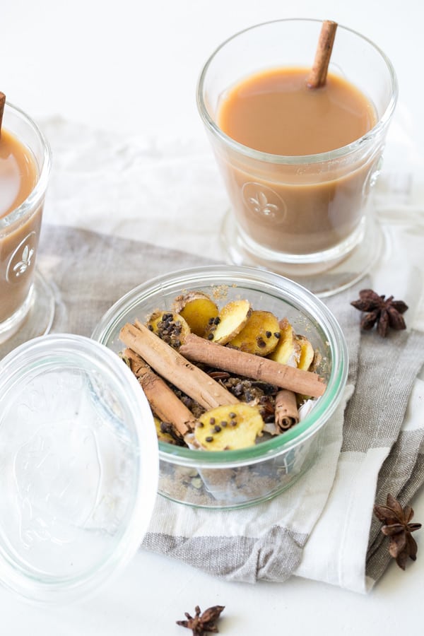 homemade chai tea on a table with chai tea mix