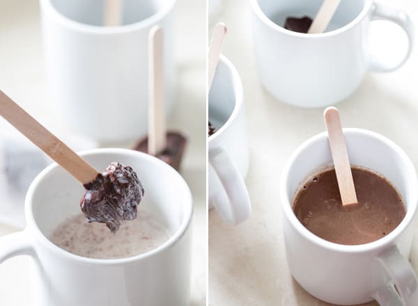 shot of chocolate on a stick being dipped into a mug