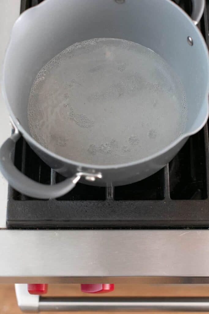 Sugar and water boiling in a pot.