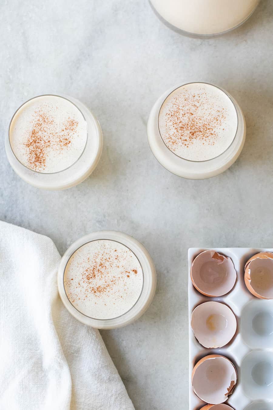 Christmas cocktail recipe with bourbon and cinnamon - spiked eggnog, spiced rum