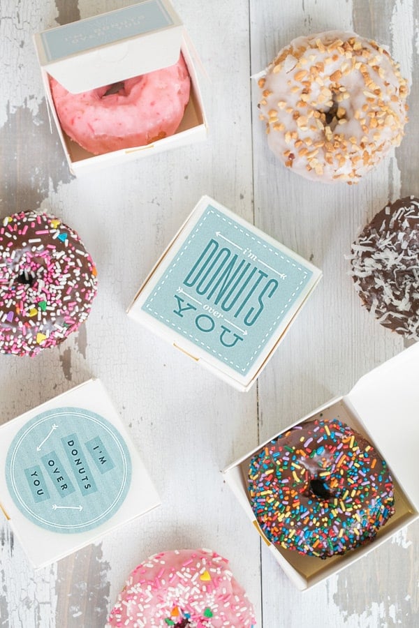 Small white boxes filled with donuts with a charming I'm Donut Valentine's Day printable.