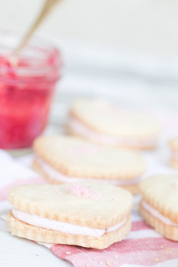 Raspberry Shortbread Cookies with White chocolate raspberry filling and raspberry sea salt.