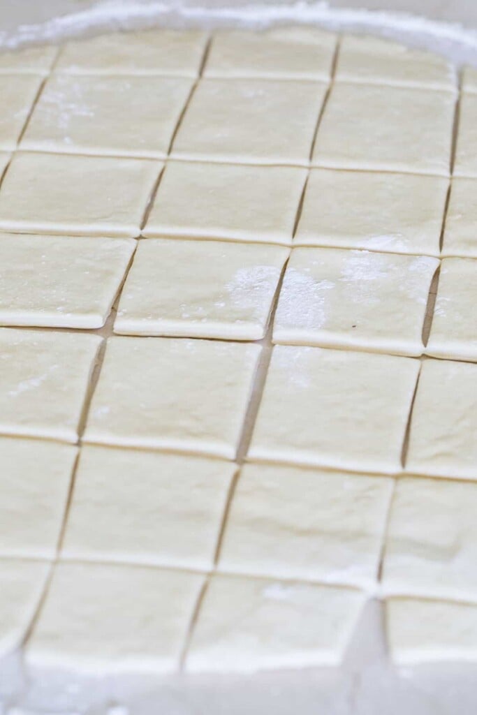 Cutting beignets.
