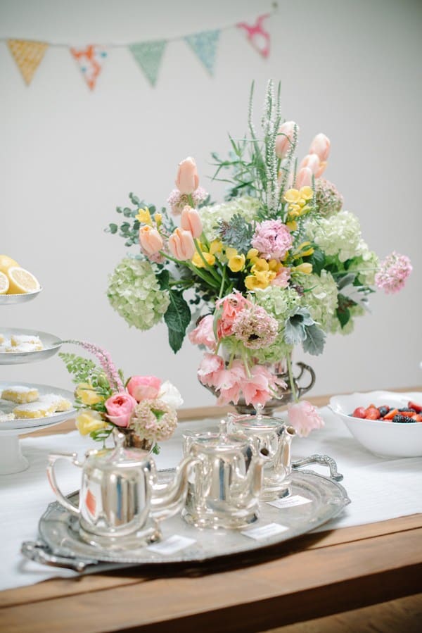 Flowers and silver tea on a tray 