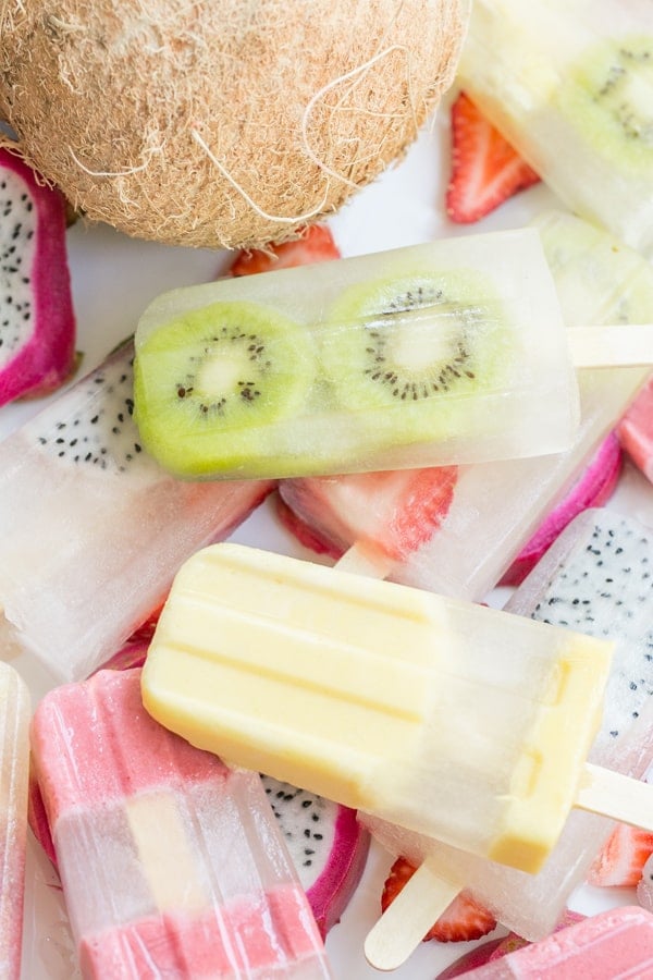 shot of fruit popsicles and a coconut