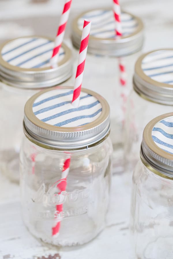 Ball canning jars with fabric top and straws