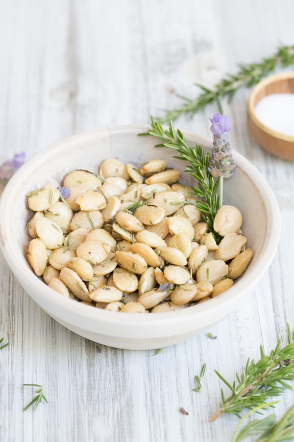 Marcona Almonds in a bowl with lavender and rosemary 