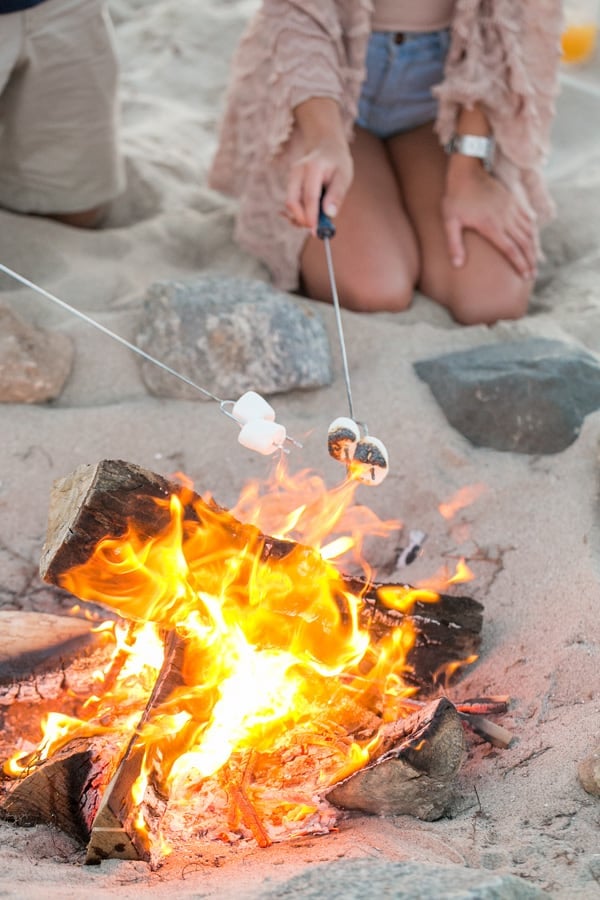 A beach bonfire for an adult birthday party.