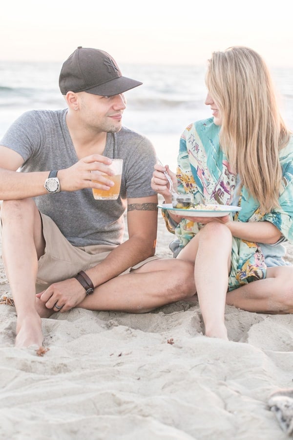 eden and zan enjoying some food on the beach 