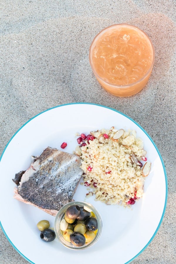 top down shot of fish cooked on the beach bonfire