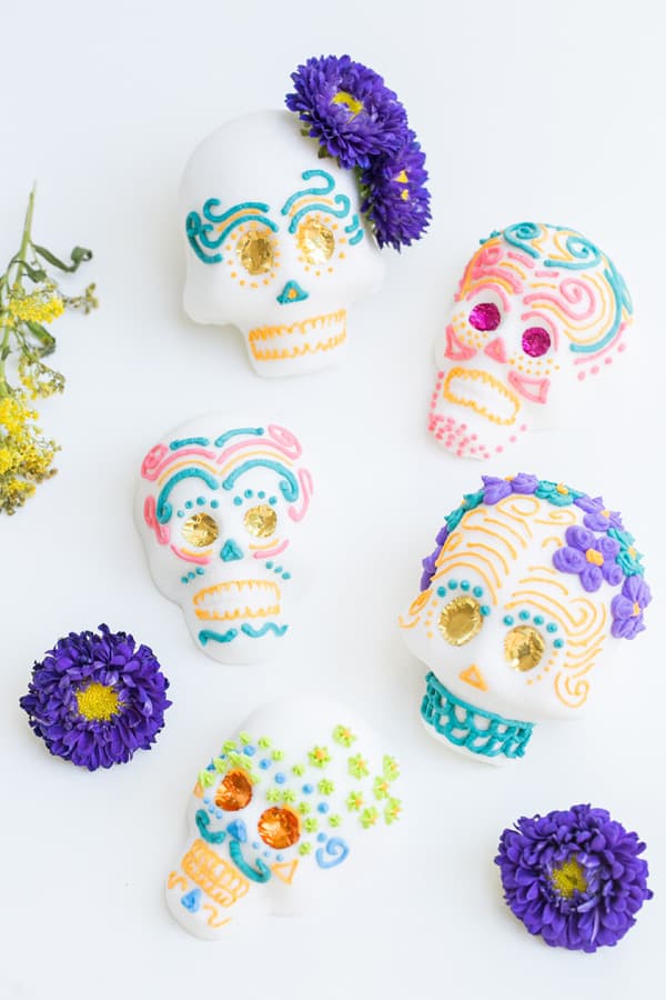 overhead shot of Mexican sugar skulls frosting with colorful frosting 