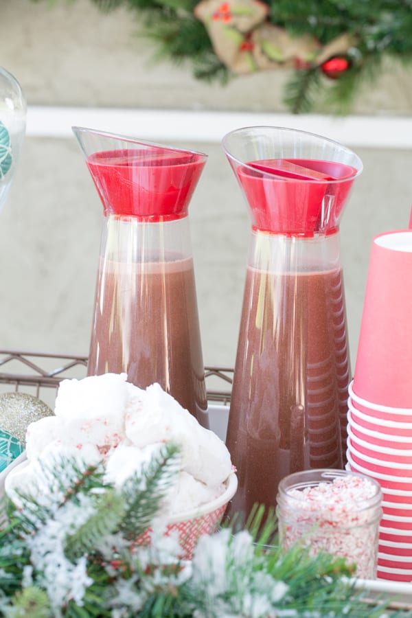 shot of cocoa in jugs on hot chocolate bar