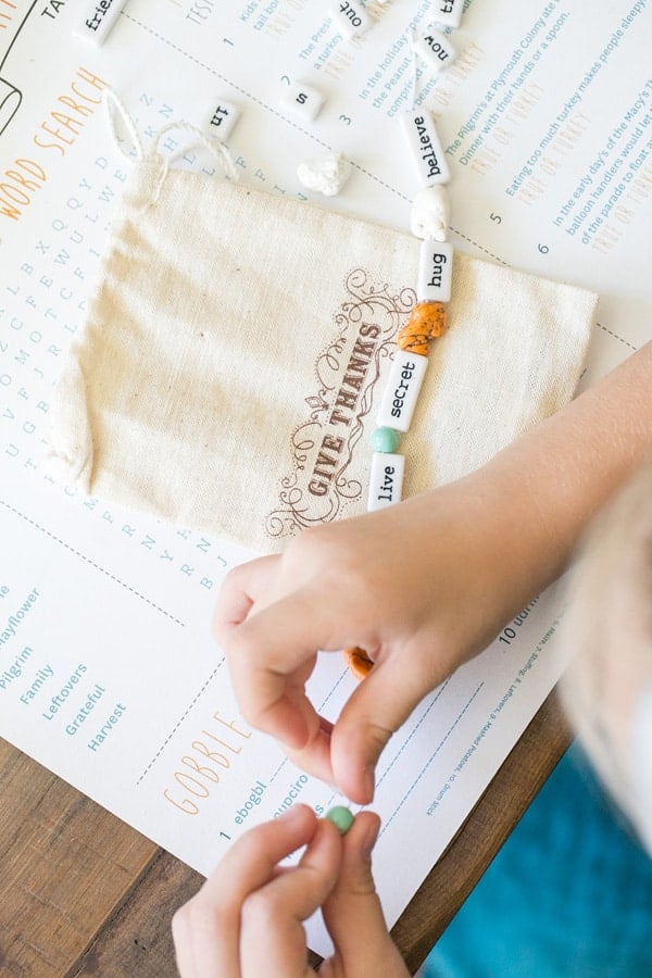 Making DIY bracelets for Thanksgiving crafts. 