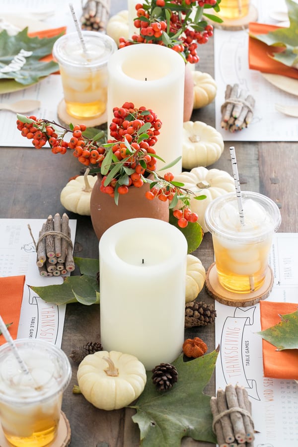 Kids Thanksgiving Table with flameless candles and flowers. 