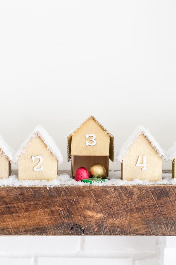 wooden house with gift underneath