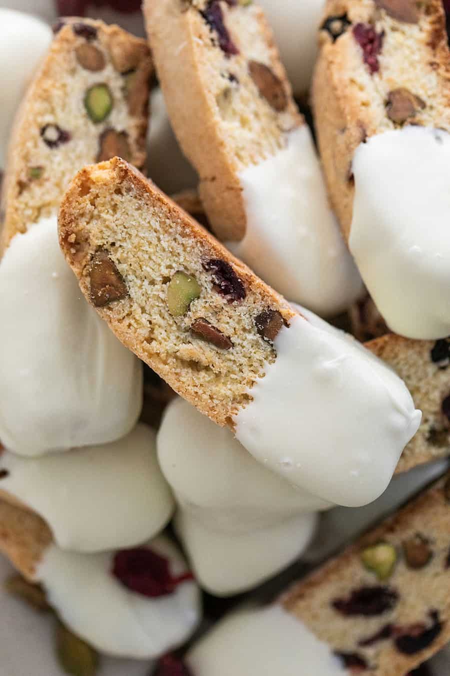 Biscotti recipe with cranberries and pistachios, dipped in white chocolate.