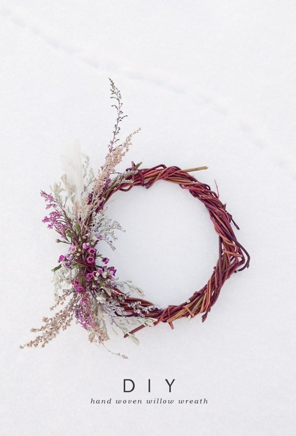 A natural handmade willow wreaths in the snow with dried flowers. - art supplies