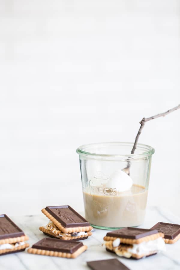 Dipping marshmallow into Baileys Irish Cream to make smores.