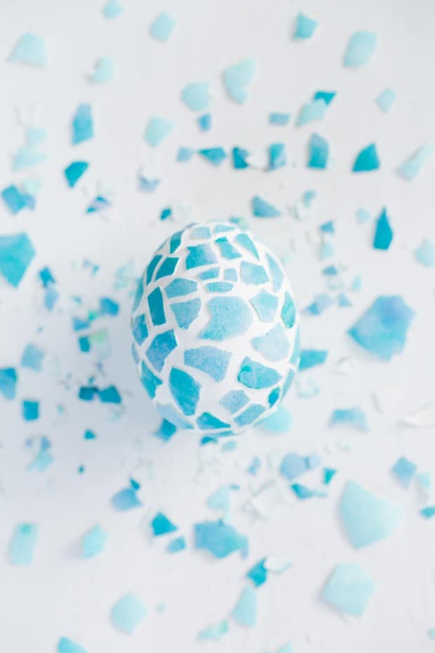 A white and blue Mosaic easter egg with cracked blue shells.