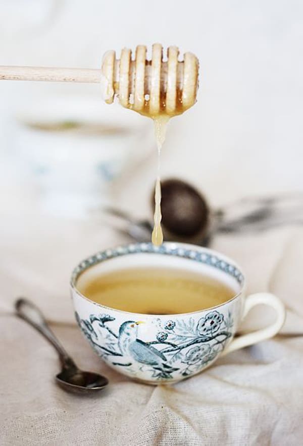 Honey going into a cup of tea 