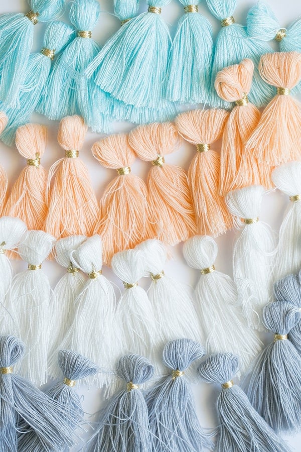 Blue, white, orange and white tassels