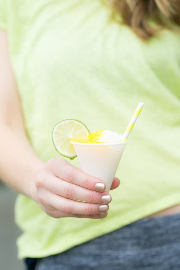 Eden Passante holding a mini fruit frozen margarita.