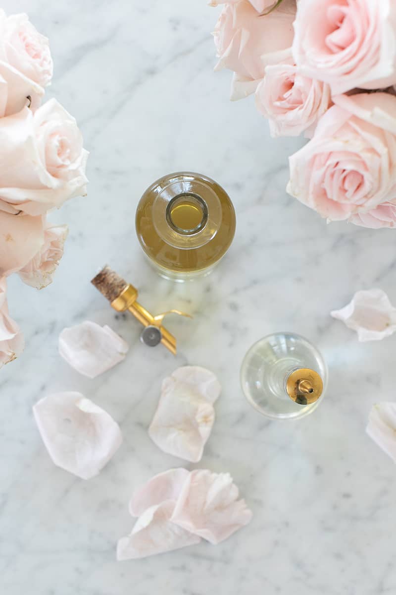 Rose water on a marble table - rose essential oil