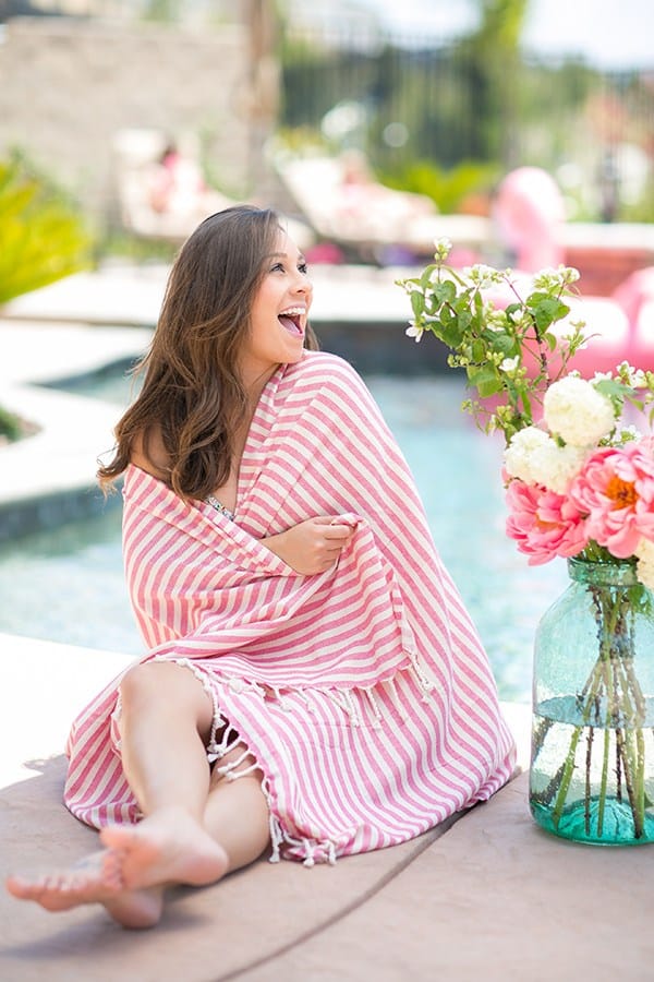 Girl with a pink striped towel wrapped  around her