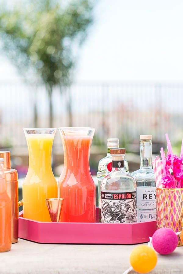 cocktail station with fresh juice and spirit bottles