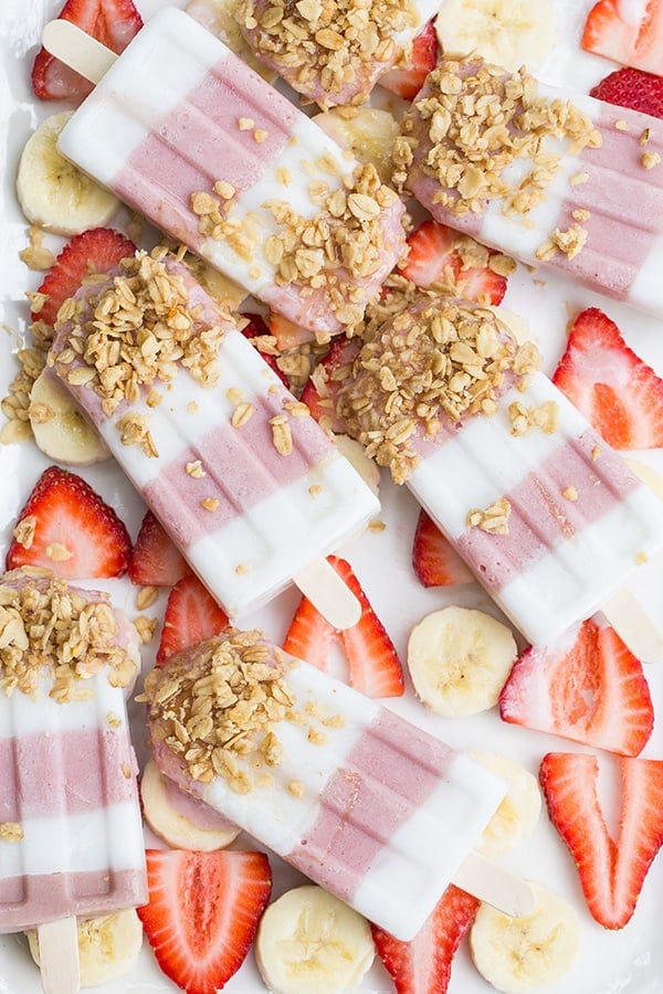 Banana and strawberry smoothies with honey and granola 