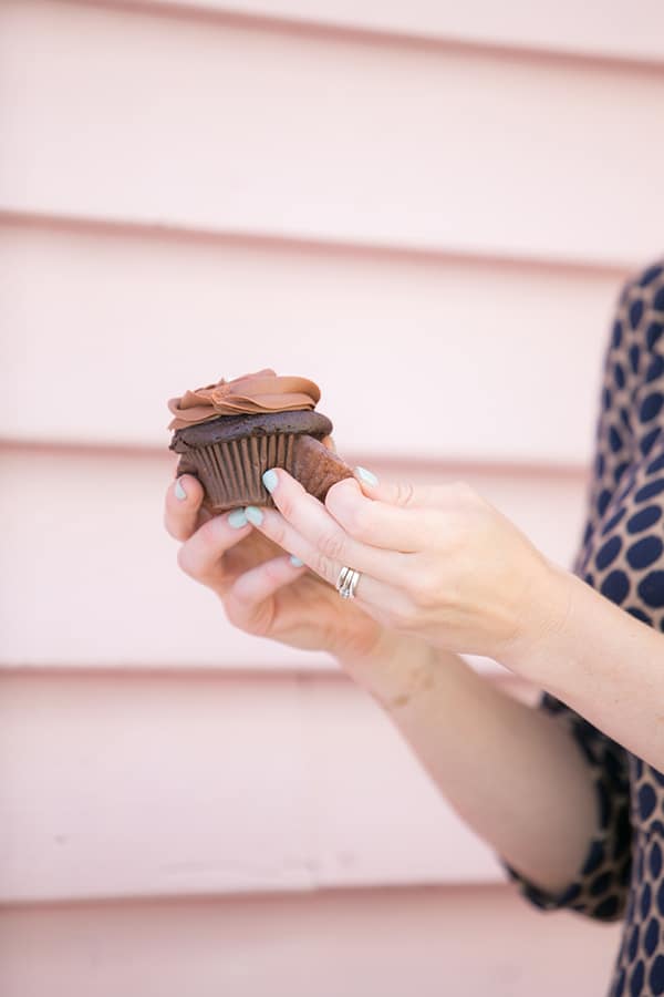 Unwrapping a chocolate cupcake 